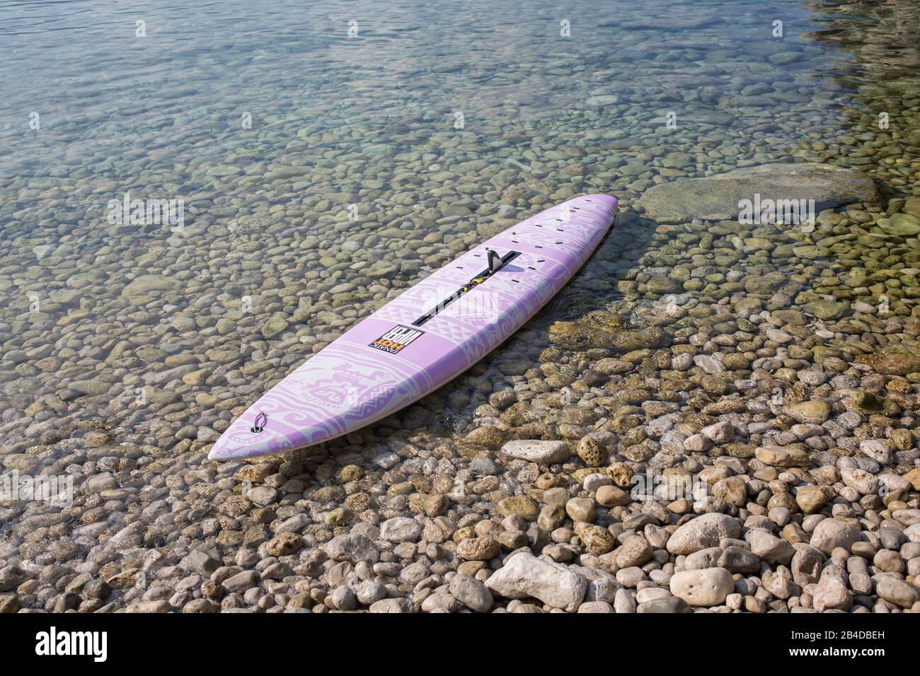 Windsurf board without sails at the stone beach hires stock