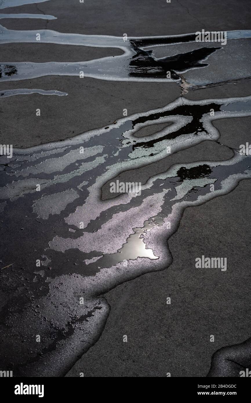 Abstract oil and water on pavement Stock Photo