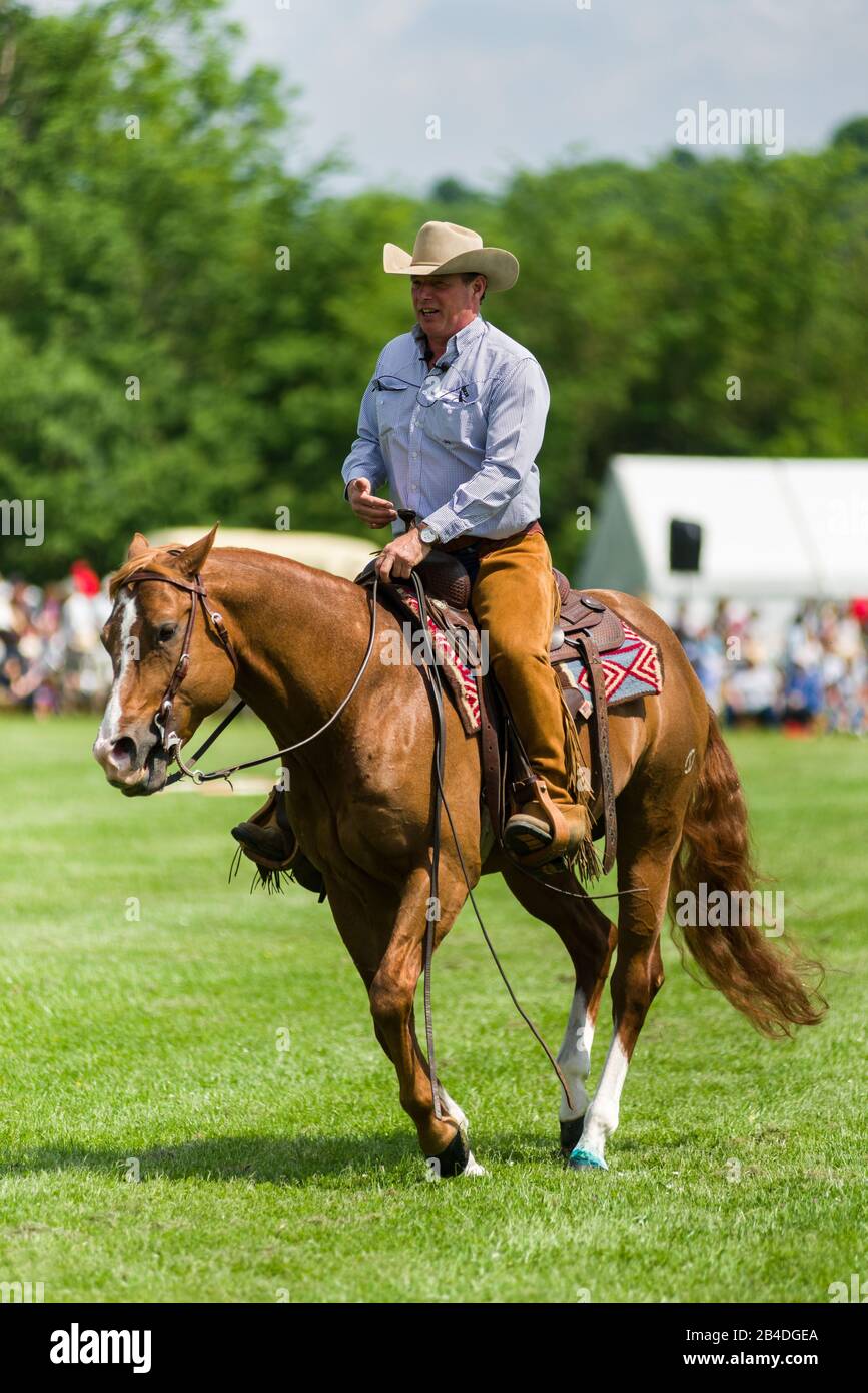 A male horse rider with crowd behind, Cambridgeshire County Show, United Kingdomwith crowd behind, Cambridgeshire County Show, United Kingdom Stock Photo