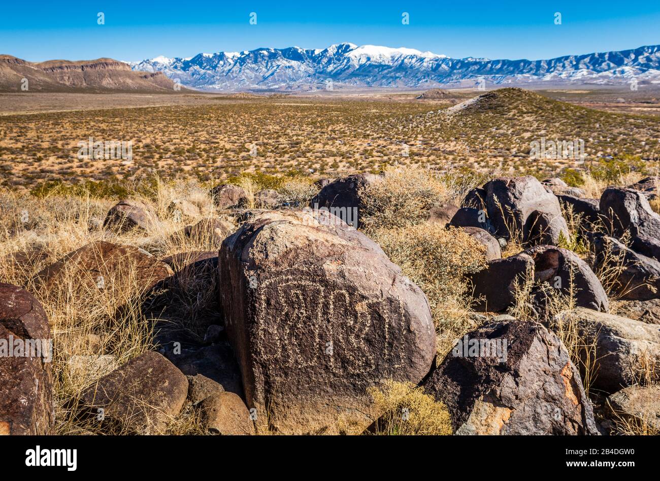 New Mexico Petroglyphs and snow-capped Sacramento Mountains, Three Rivers, New Mexico, USA. Stock Photo