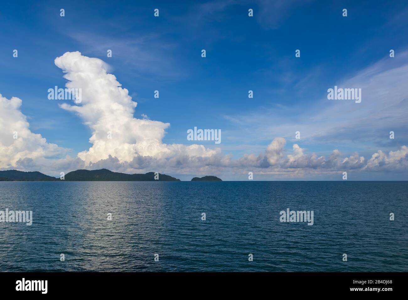 Blue sky with white cloud and deep blue sea Stock Photo - Alamy