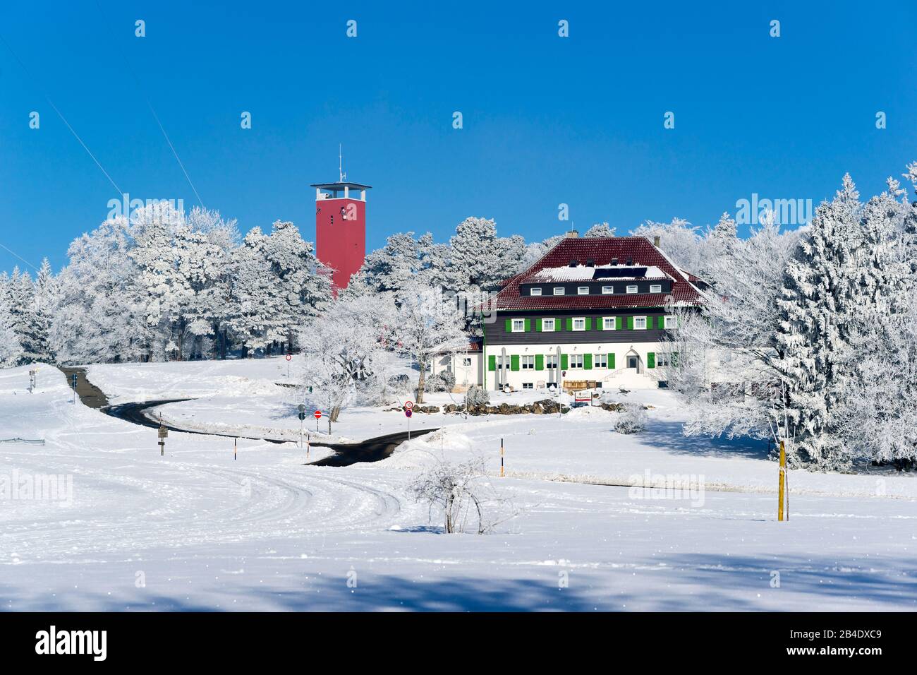 Germany, Baden-Württemberg, Albstadt-Onstmettingen, Wanderheim Nails house on the Raichberg, left next to the Raichbergturm, a lookout tower of the Swabian Albverein. The hiking house Nägelehaus on the Raichberg offers catering and accommodation. The name of the house was given by Eugen Nägele, who was chairman of the Swabian Albverein from 1913 to 1933. In 1969, the European Walking Federation was founded in Nägelehaus. Stock Photo