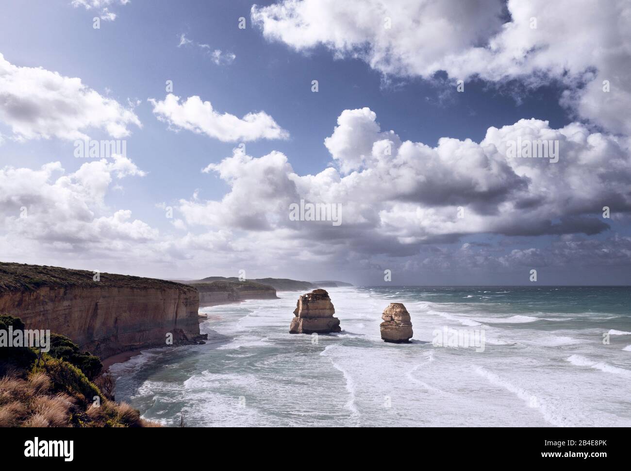 Two of the 12 apostles in the morning light in storm and violent surf Stock Photo