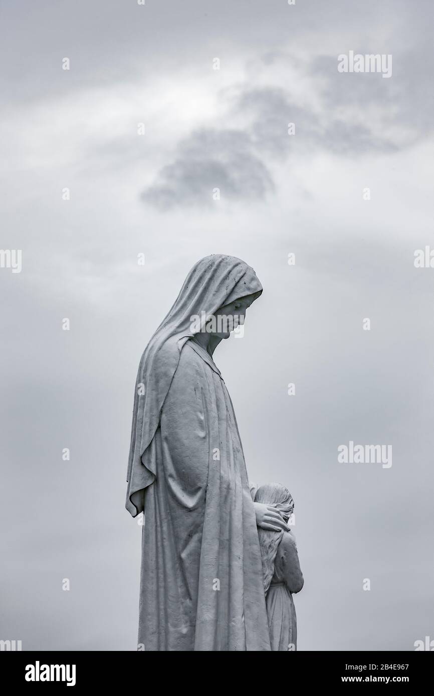 White Madonna in marble in Lourdes Stock Photo