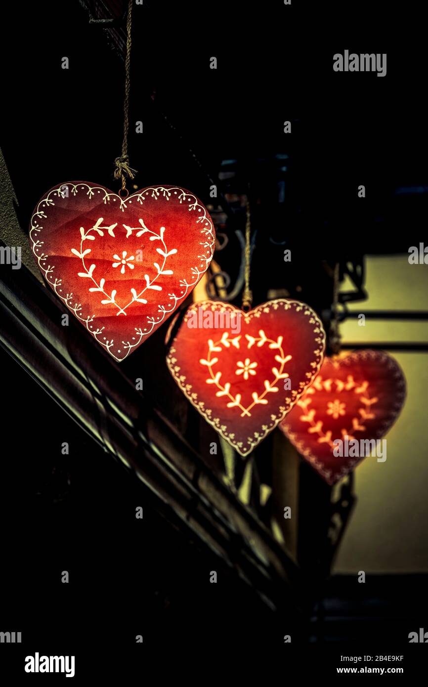 Three red plate hearts as decoration Stock Photo