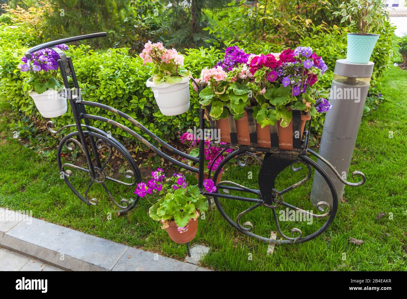 Azerbaijan, Baku, bicycle with flowers detail, small city park Stock Photo