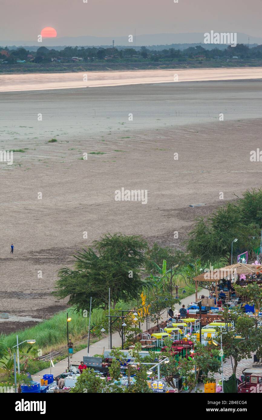 Laos, Vientiane, high angle view of Mekong Riverfront restaurant, dusk Stock Photo