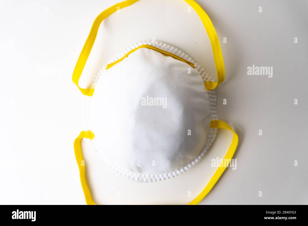 A white face mask on white background Stock Photo - Alamy