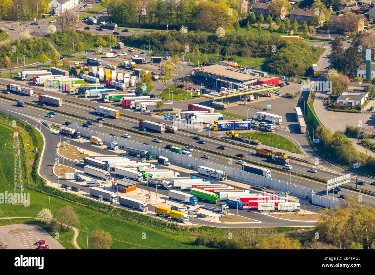 Aerial view from the rest area Bottrop on the A2 motorway with the truck parking spaces in the Ruhr area in the state of North Rhine-Westphalia, Germany. The trucks are in the parking lots. Stock Photo