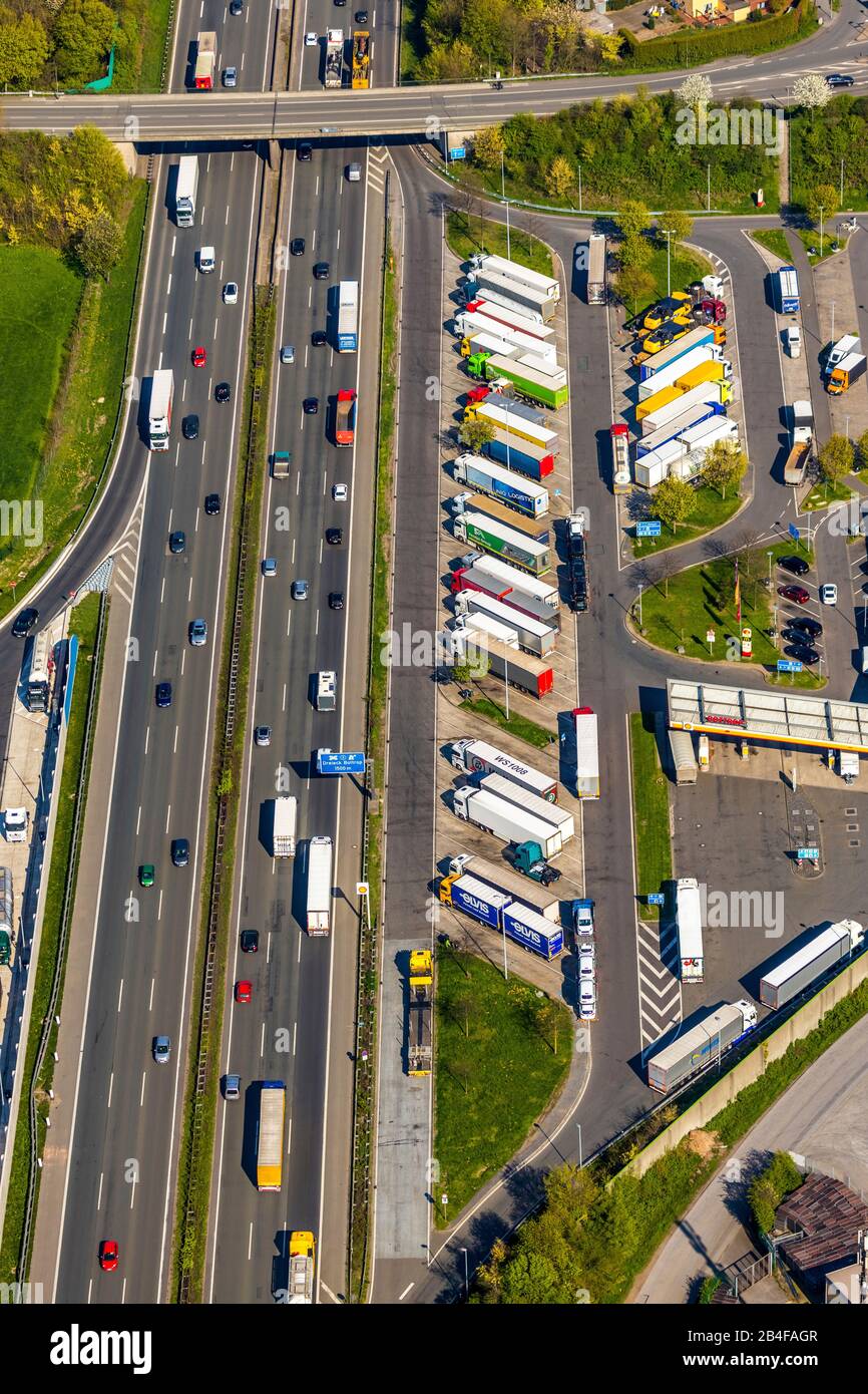 Aerial view from the rest area Bottrop on the A2 motorway with the truck parking spaces in the Ruhr area in the state of North Rhine-Westphalia, Germany. The trucks are in the parking lots. Stock Photo