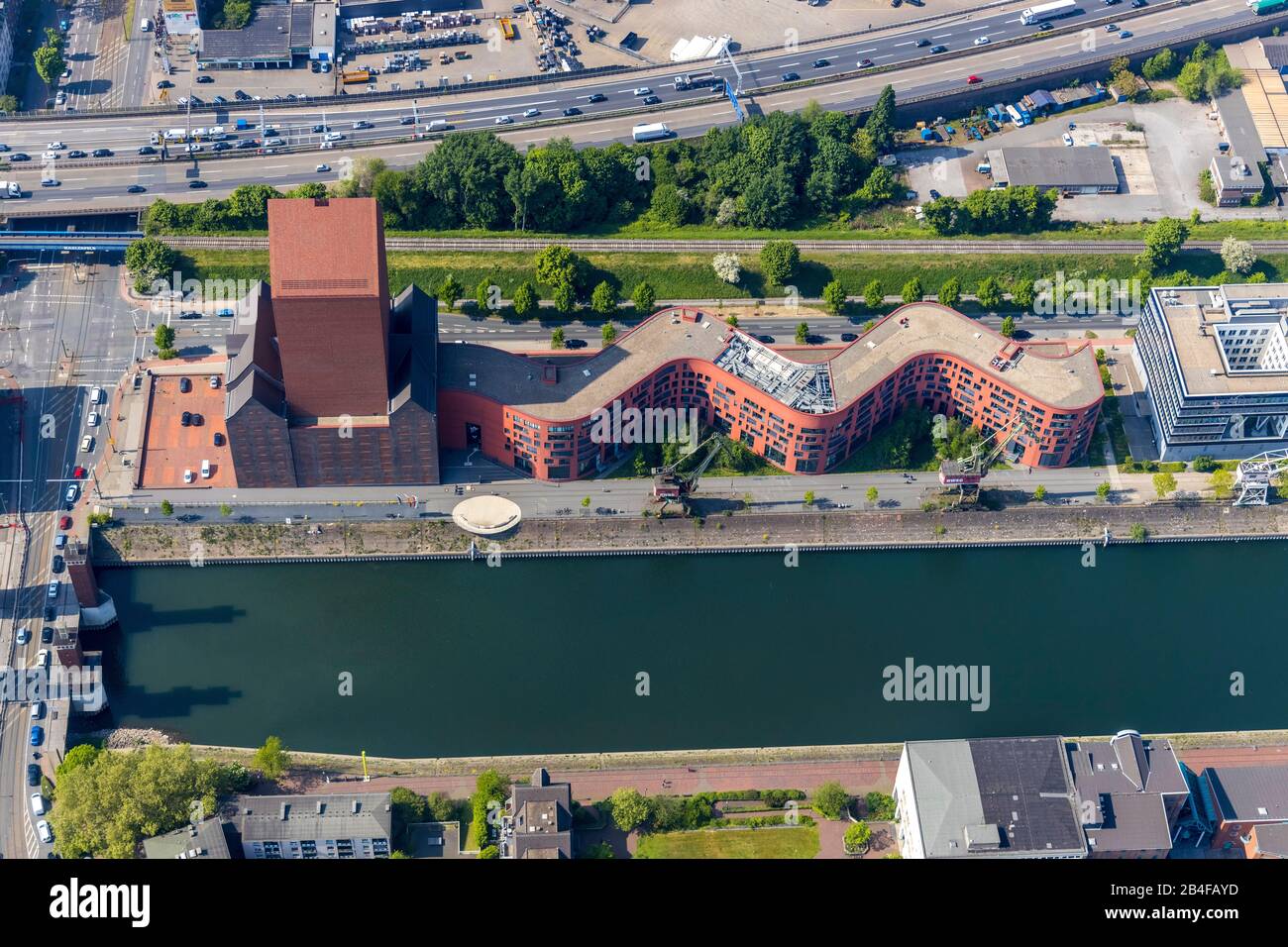 Aerial view of the building of the Landesarchiv NRW department Rheinland. In the foreground, the historic, listed harbor cranes in the inner harbor in Duisburg in the Rhine-Ruhr metropolitan region in the state of North Rhine-Westphalia, Germany Stock Photo