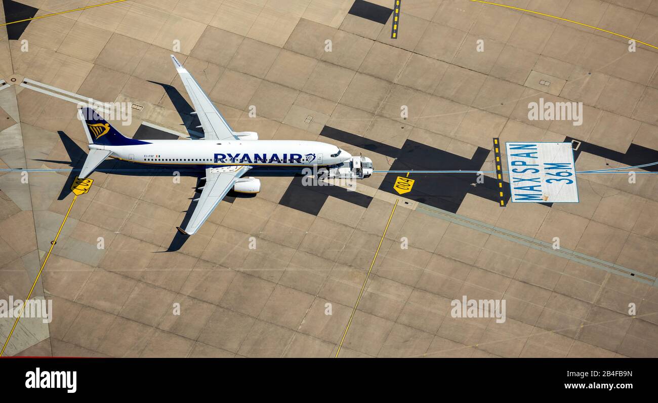 Aerial view of the airport Cologne / Bonn 'Konrad Adenauer', with RyanAir plane on the apron at a parking position, park marker, international airport in the southeastern city area in Cologne-Grengel and to a small part on Troisdorf area in Cologne in the Rhineland in the federal state of North Rhine-Westphalia, Germany, Stock Photo