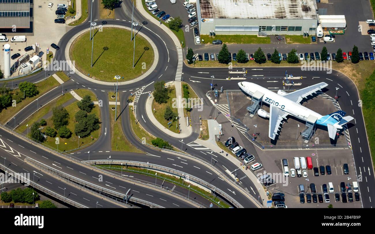 Aerial view from the airport Cologne / Bonn 'Konrad Adenauer' with roundabout to the parking lots and ZERO-G restaurant in a plane, international airport in the southeastern city area in Cologne-Grengel and to a small part on Troisdorf area in Cologne in the Rhineland in the federal state North Rhine-Westphalia , Germany, Stock Photo
