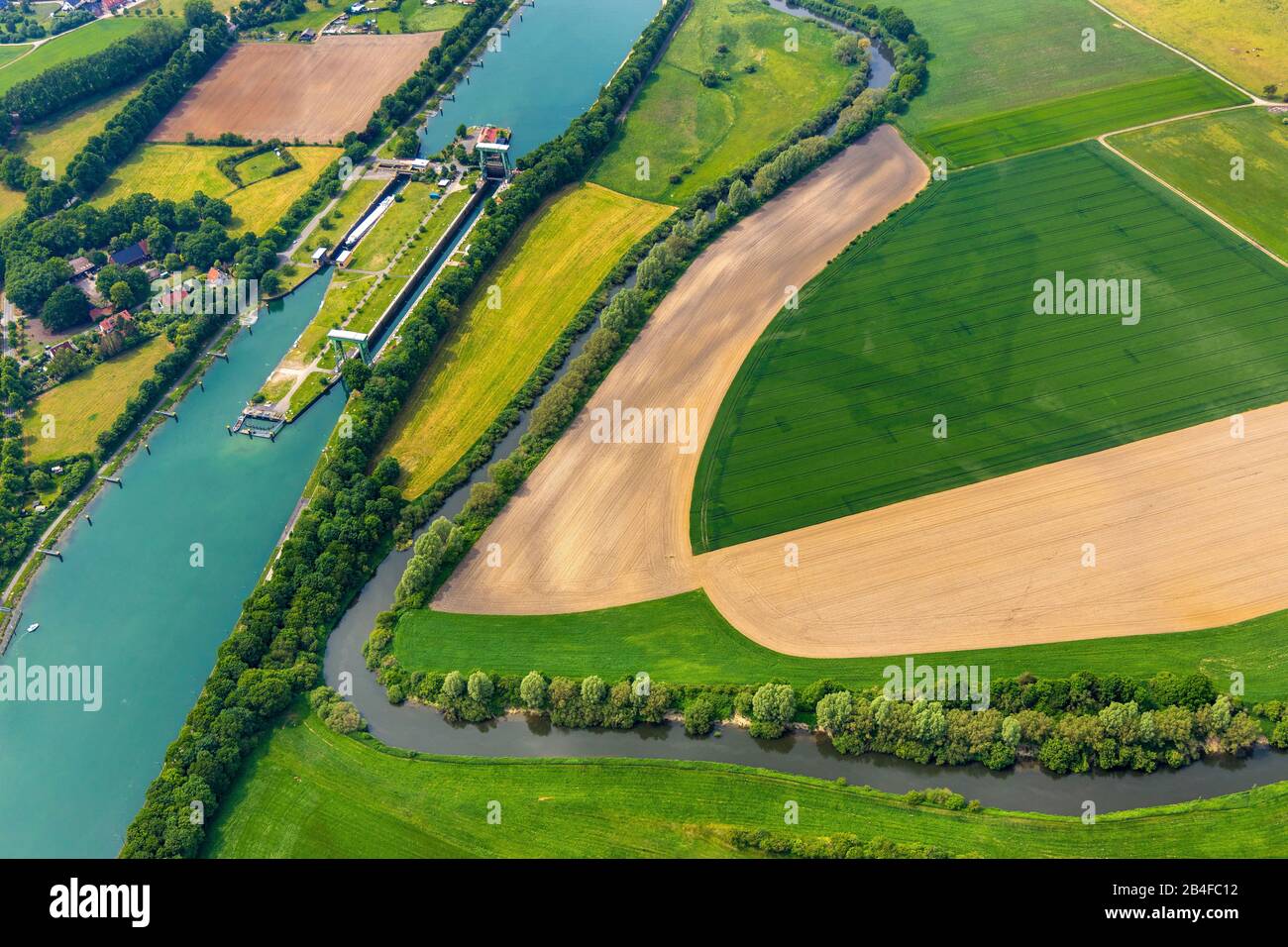 Aerial view of the Flaesheim lock with cargo ship in the smaller lock chamber on the Wesel-Datteln canal in Haltern am See in the Hohe Mark-Westmünsterland nature park in the state of North Rhine-Westphalia, Germany Stock Photo