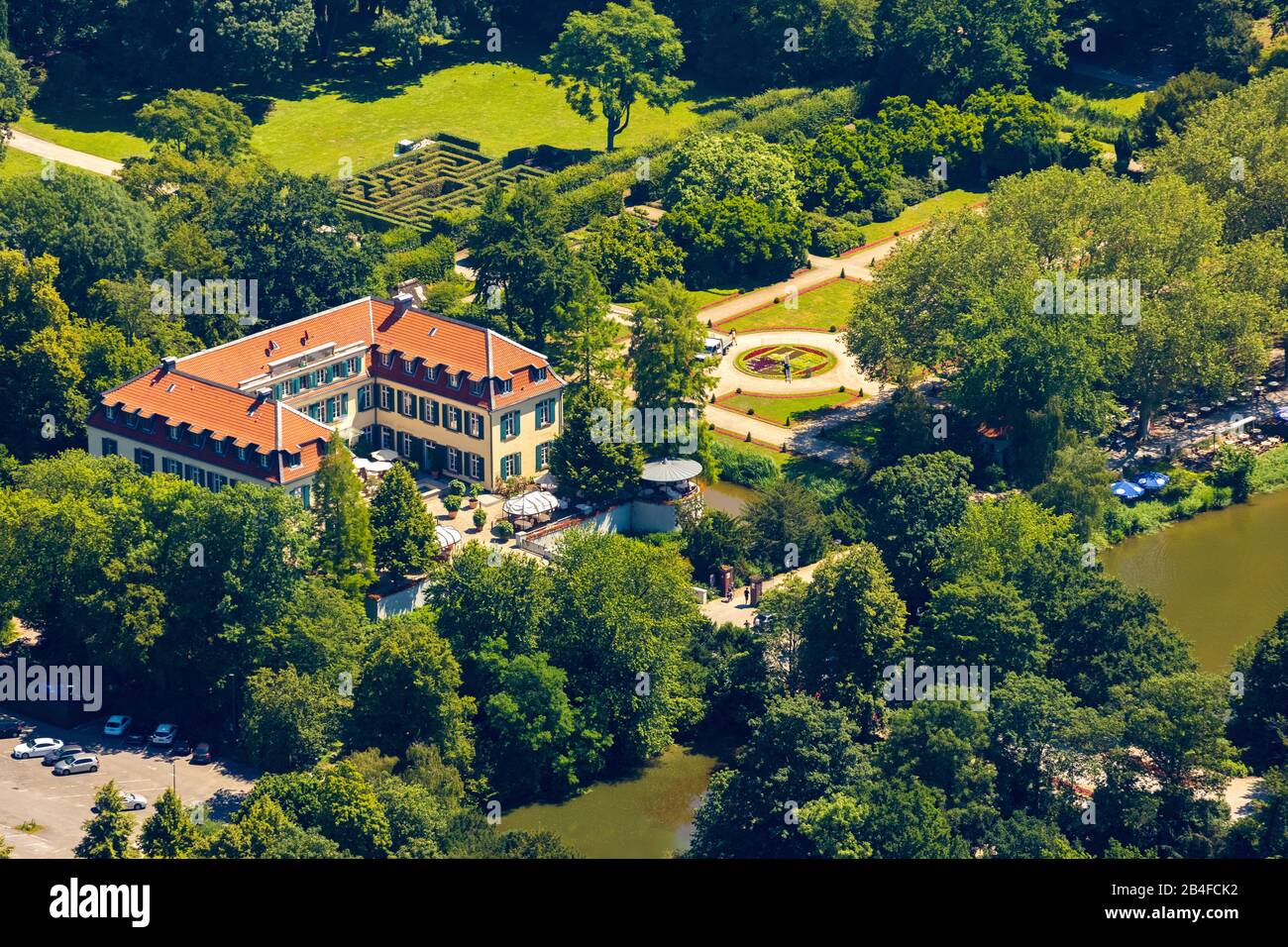Aerial view of Schloss Berge with baroque garden and bed with city emblem of Gelsenkirchen with gardener who works in the flowerbed with the help of a ladder in Gelsenkirchen in the Ruhrgebiet in North Rhine-Westphalia in Germany, Gelsenkirchen, Ruhrgebiet, North Rhine-Westphalia, Germany Stock Photo