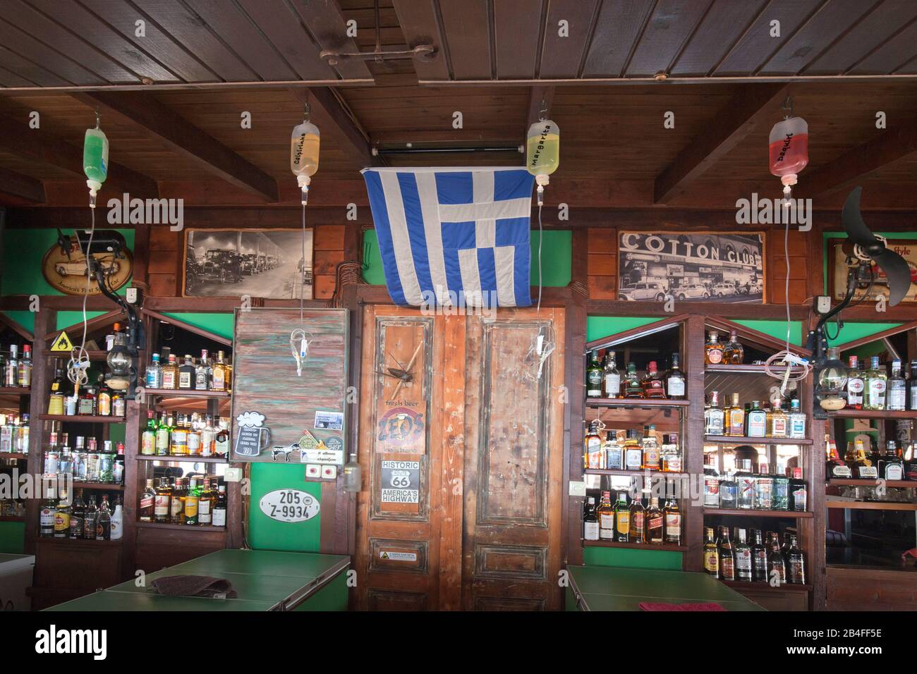 rustic tavern with luscious alcohol offer in Greece Stock Photo