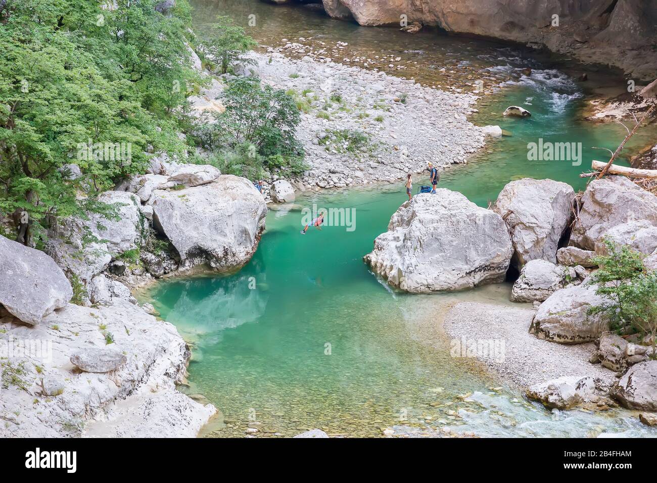 Man crossing the Verdon Gorge on a rope, Alpes de Haute Provence, Provence, France Stock Photo