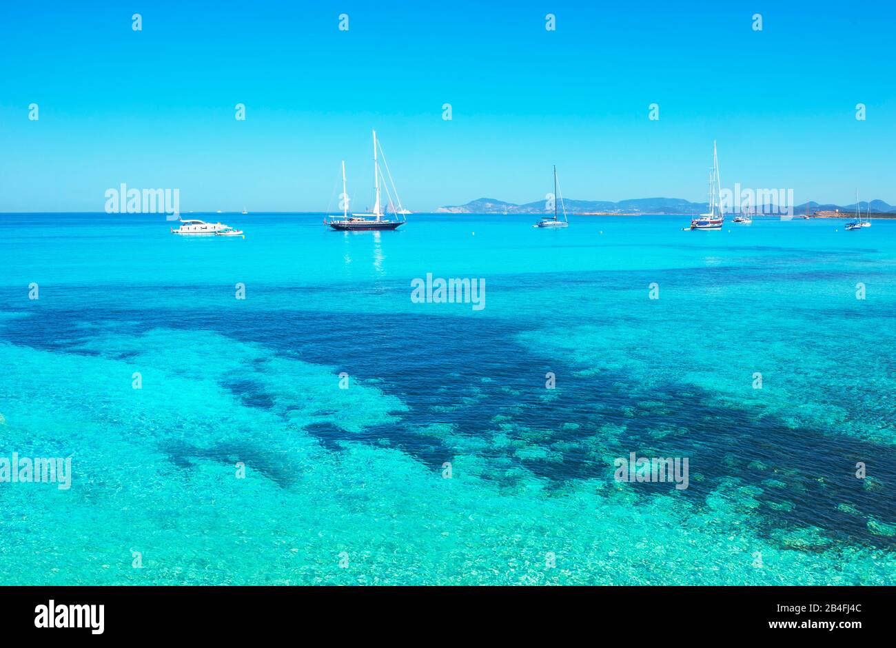Sailing boats anchored at Ses Illetes beach, Formentera, Balearic Islands, Spain Stock Photo
