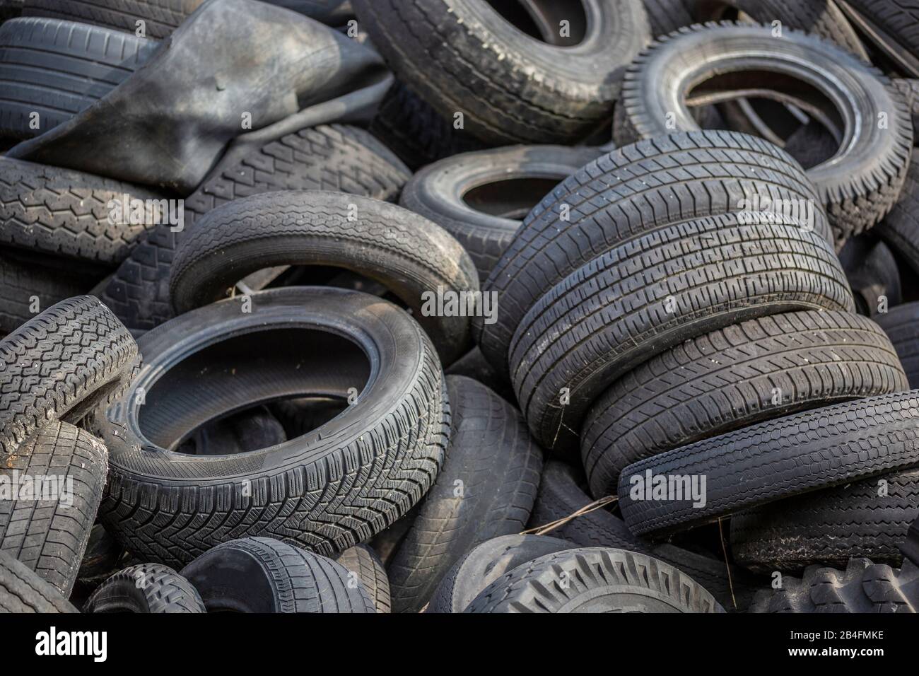 old worn tires of different motor vehicles Stock Photo