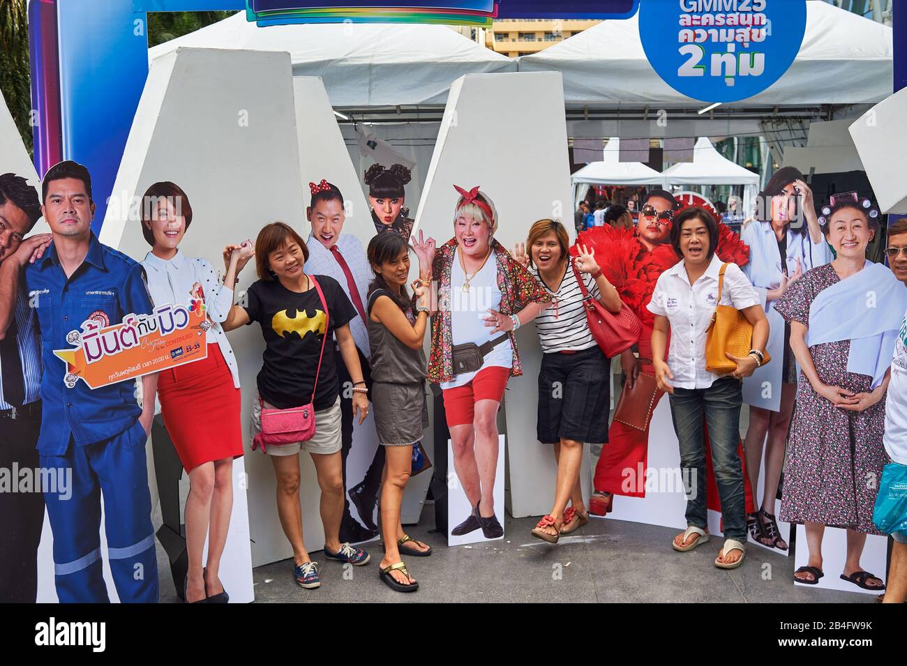 BANGKOK, THAILAND - CIRCA JUNE, 2015: people taking photos with life-size cutouts in Bamgkok at daytime. Stock Photo