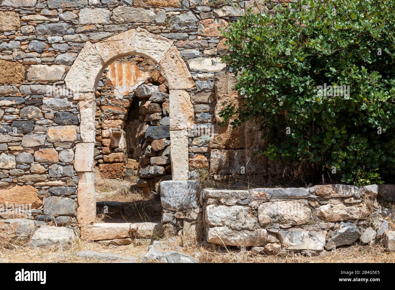 View on archway of a ruined house on the leprosy island Spinalonga, Greece, Crete, Kalydon Stock Photo