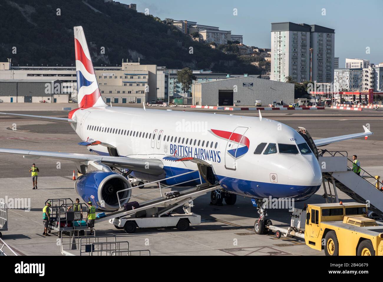 British Airways plane unloading luggage, airport, Gibraltar Stock Photo