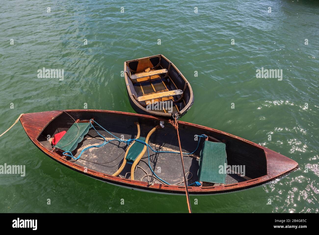 Two empty boats for remelting, moored on the marina Stock Photo - Alamy