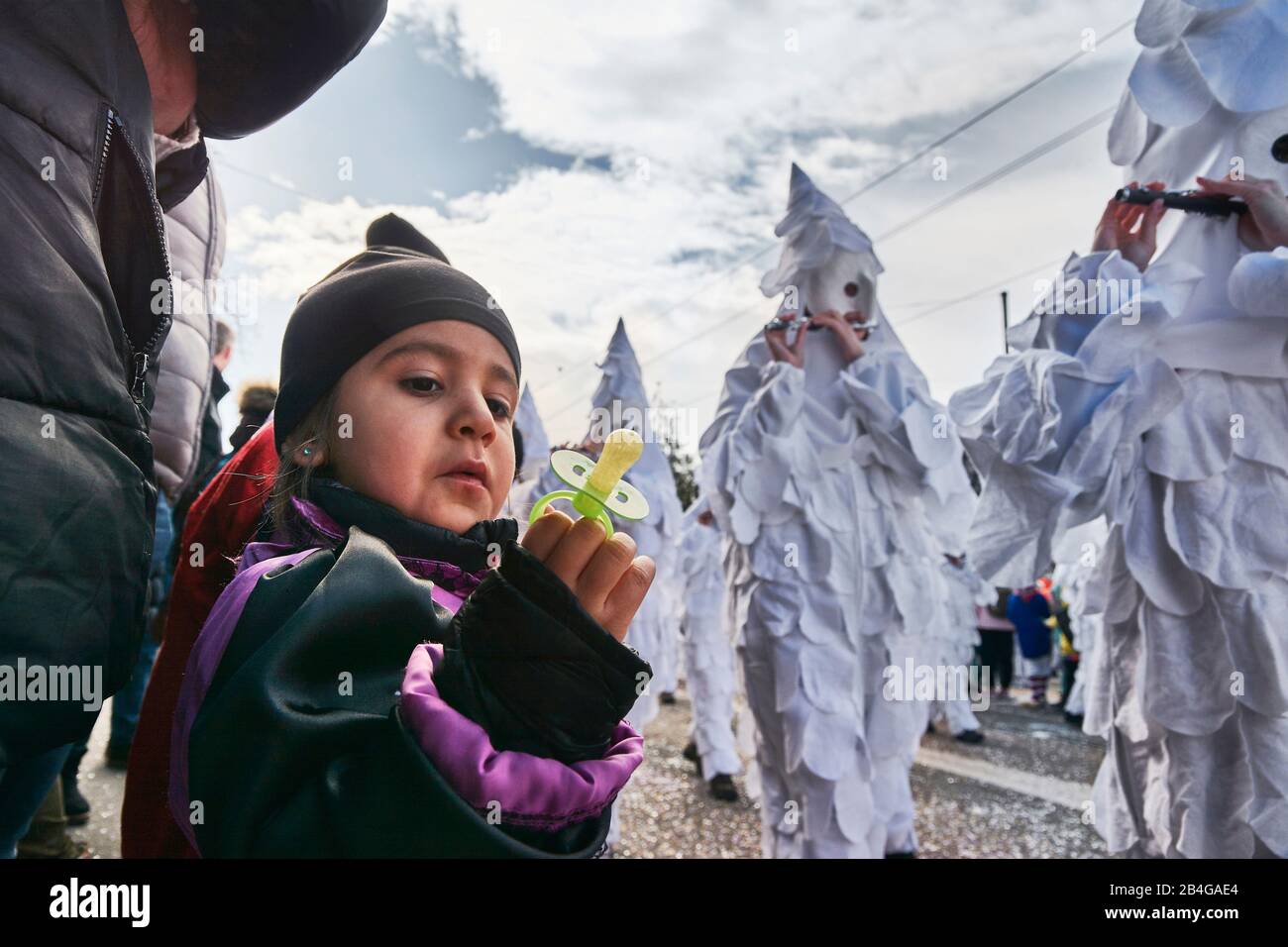 Europe, Switzerland, Basel, Traditional event, Basel Fasnacht, the largest in Switzerland, intangible cultural heritage of mankind, Cortège at Wettsteinplatz, spectator, child with pacifier in front of Pfeifer clique Stock Photo