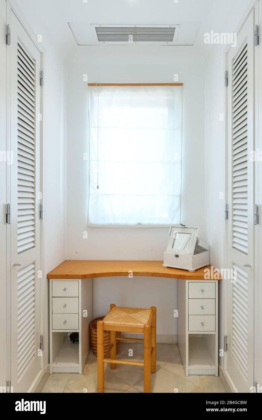Wardrobe for clothes and shoes. With a table and a mirror Stock Photo