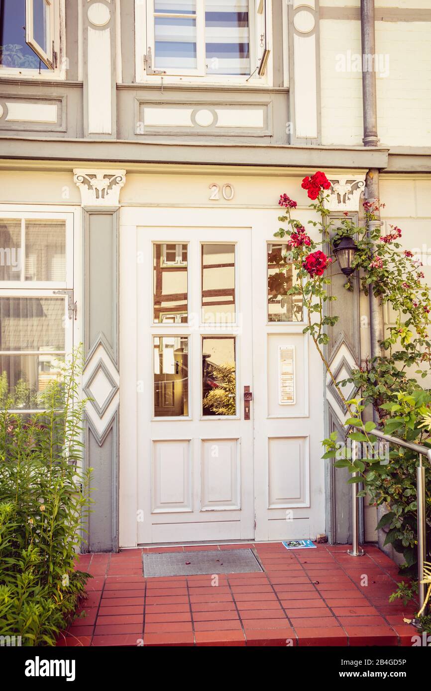 House facade, front door, windows, flower decoration, Wolfenbüttel, Lower Saxony, Germany, Europe Stock Photo