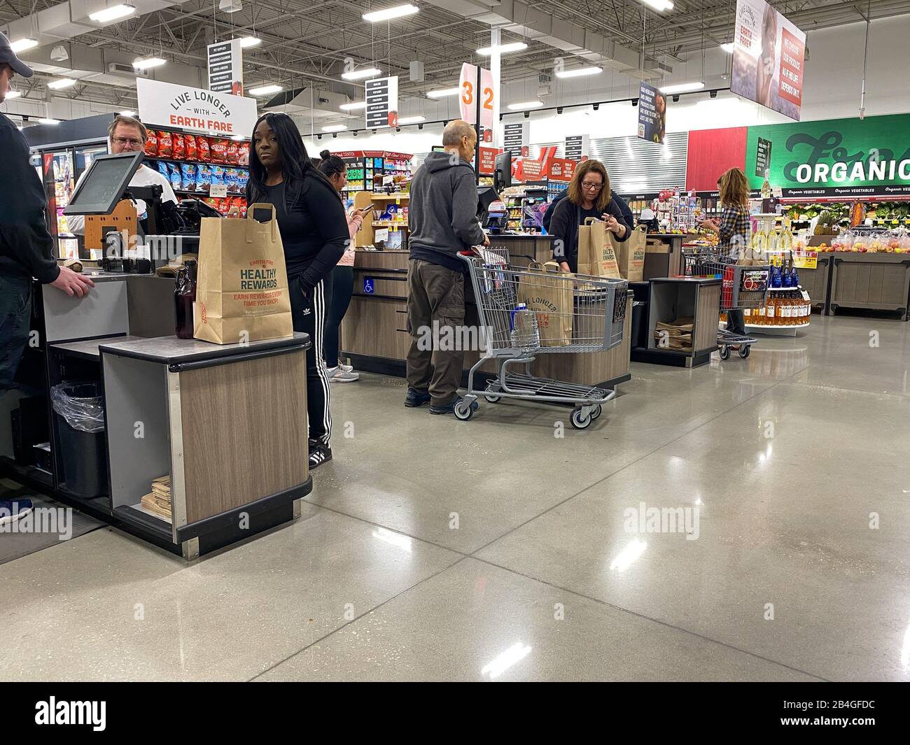Orlando,FL/USA12/14/19 Grocery store employees scanning food items at