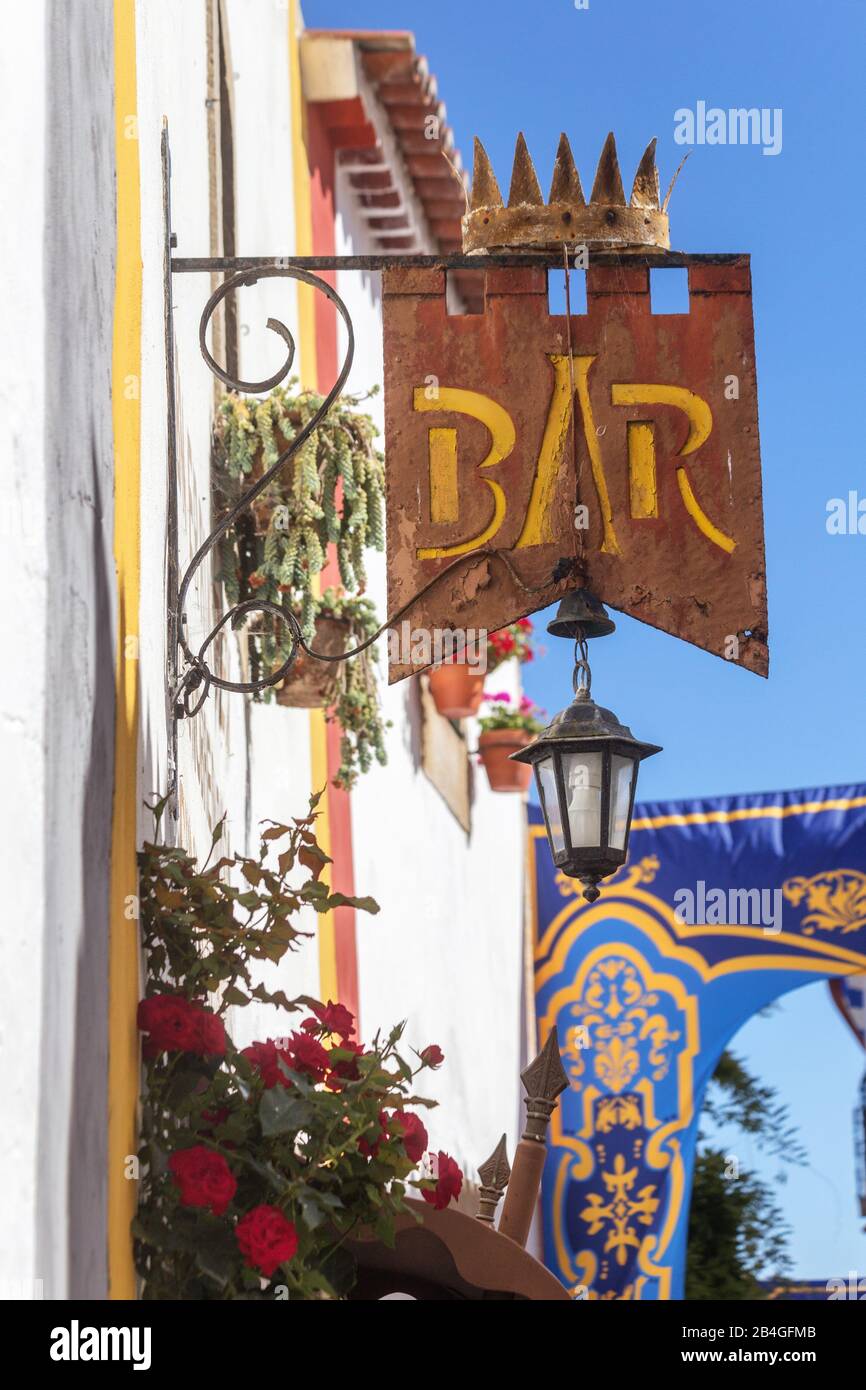 Ancient signboard Bar, on the streets of the village of Obidos ...