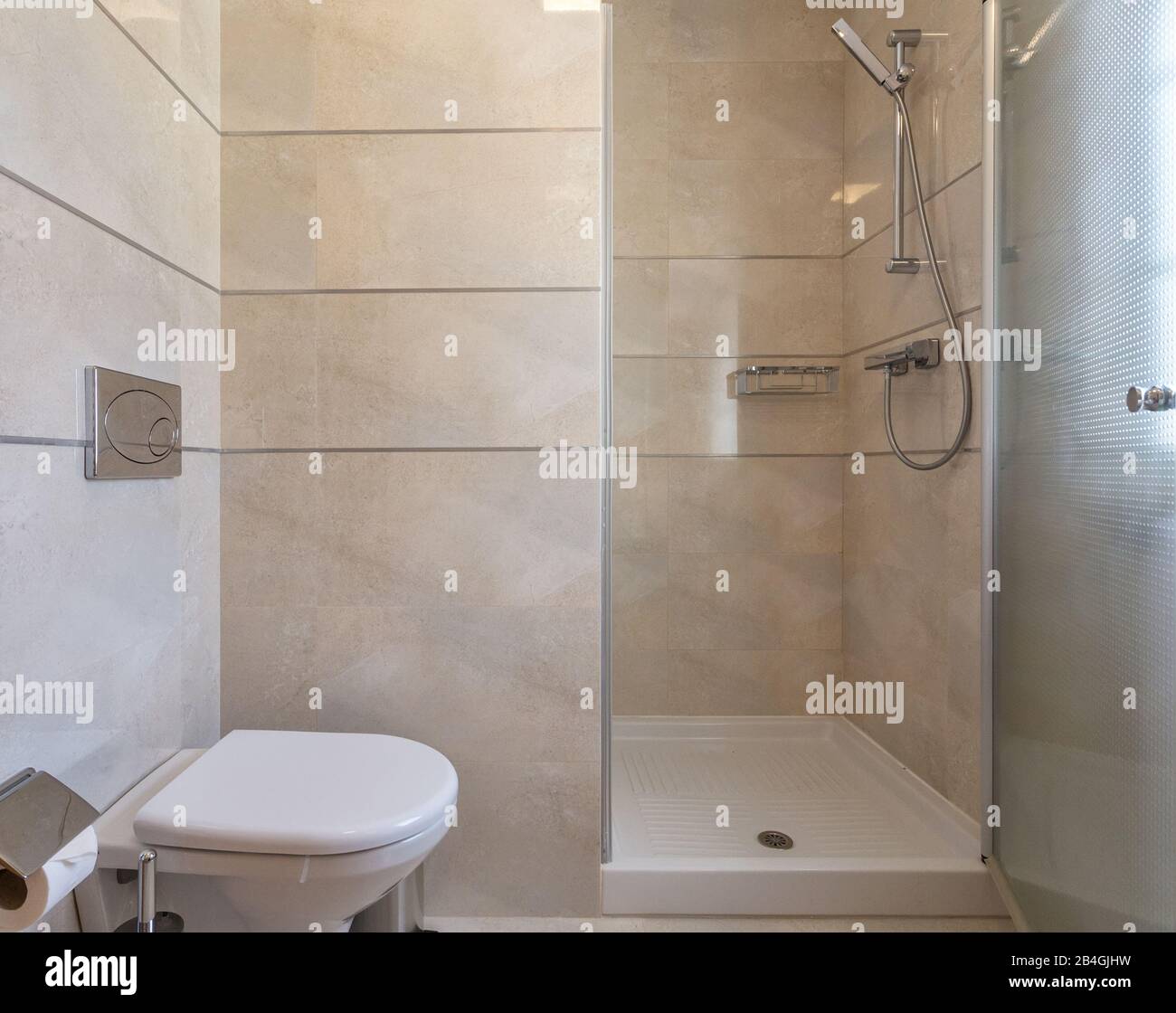 Modern bathroom shower room with toilet and amenities Stock Photo - Alamy