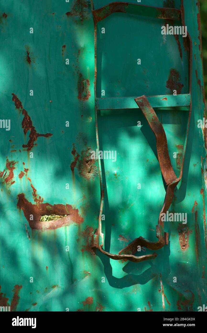 The bent ladder of a rusted container. Stock Photo