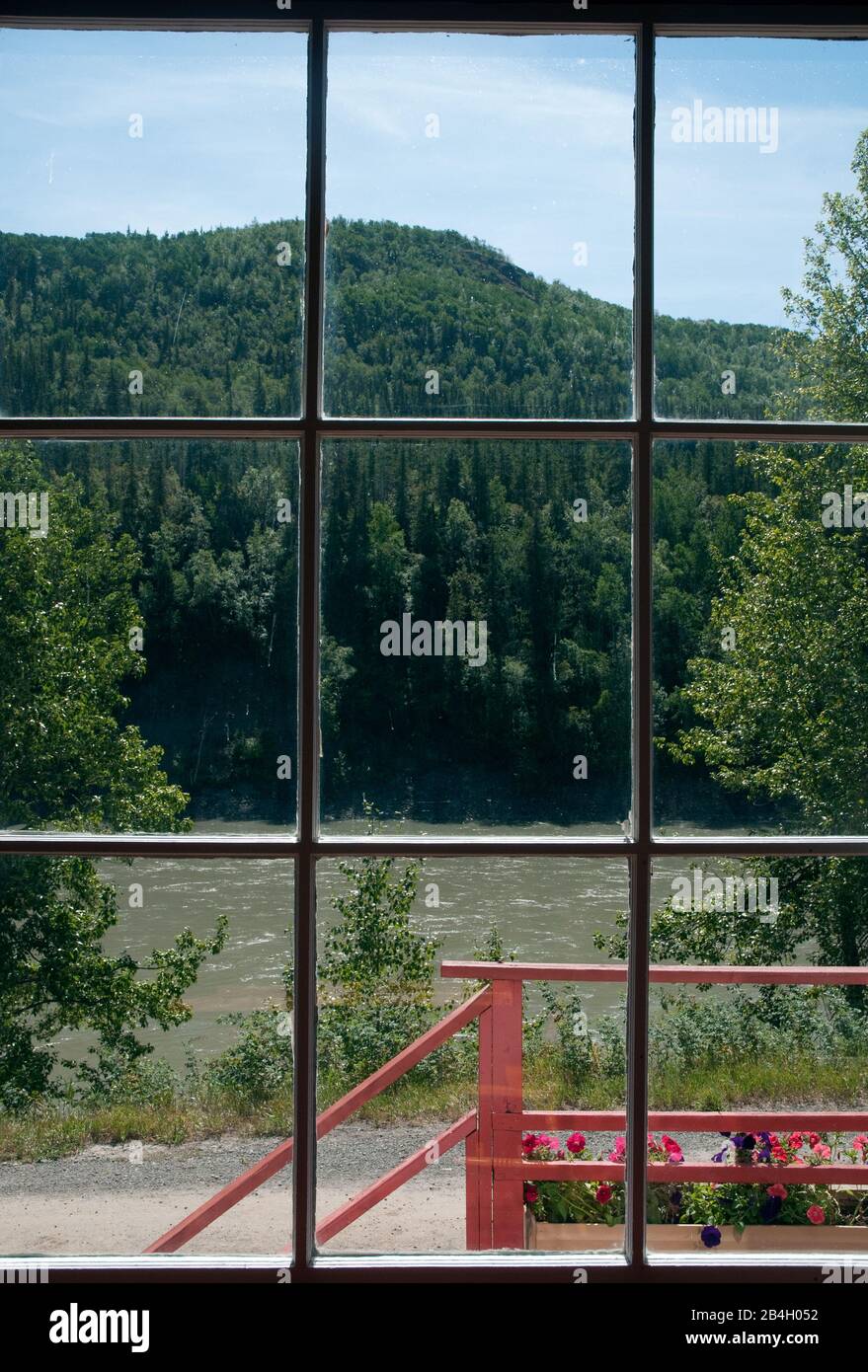 A window view of the Stikine River in the historical 19th century gold rush era town of