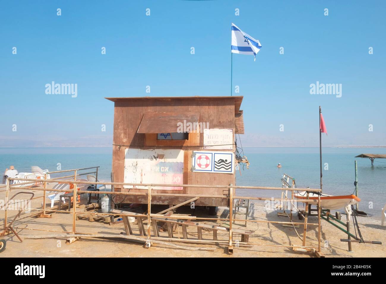 Lifeguard post at Dead Sea. The red flag is raised all the time due to dangerous sea Stock Photo