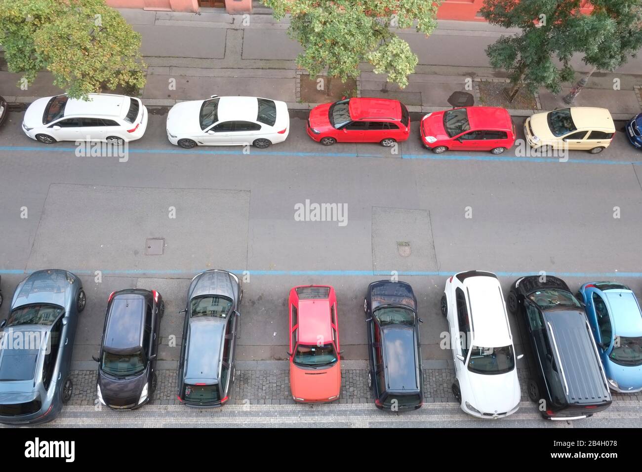 Aerial view of cars parallel parked and perpendicular parked on either side of Prague street. Czech Republic Stock Photo