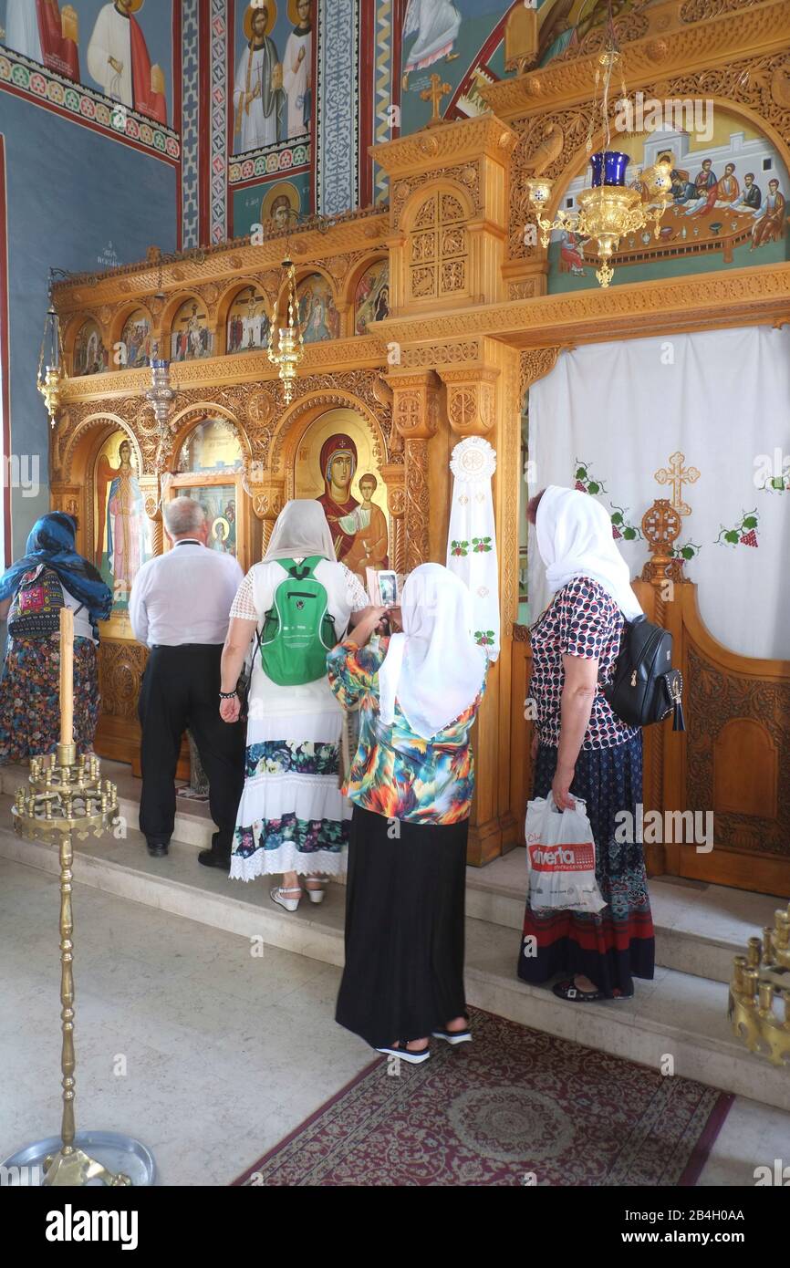 Believers pay respect to Virgin Mary at Greek Orthodox Church, Jerusalem. Stock Photo