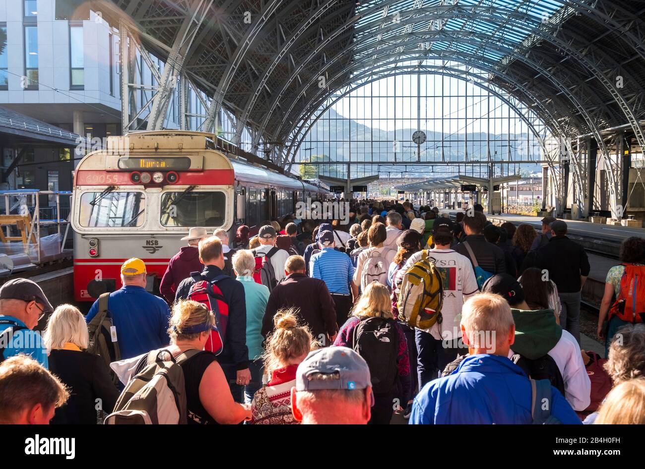 Tourists on the station of Bergen, glass dome roof, train, Bergen