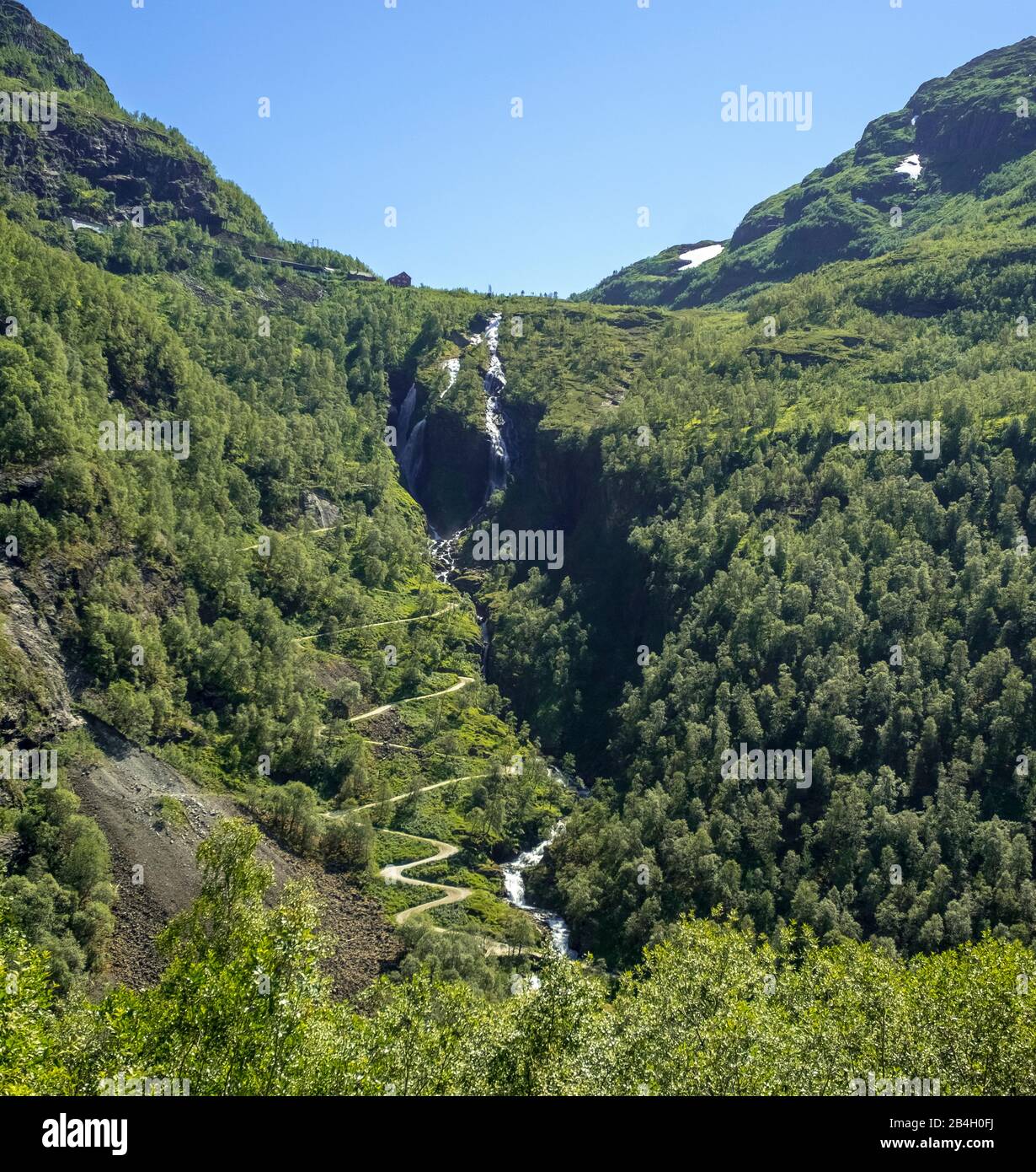 Kjosfossen waterfall, waterfall near Fureberget, mountain, forest, road, sky Flåm, Sogn og Fjordane, Norway, Scandinavia, Europe Stock Photo