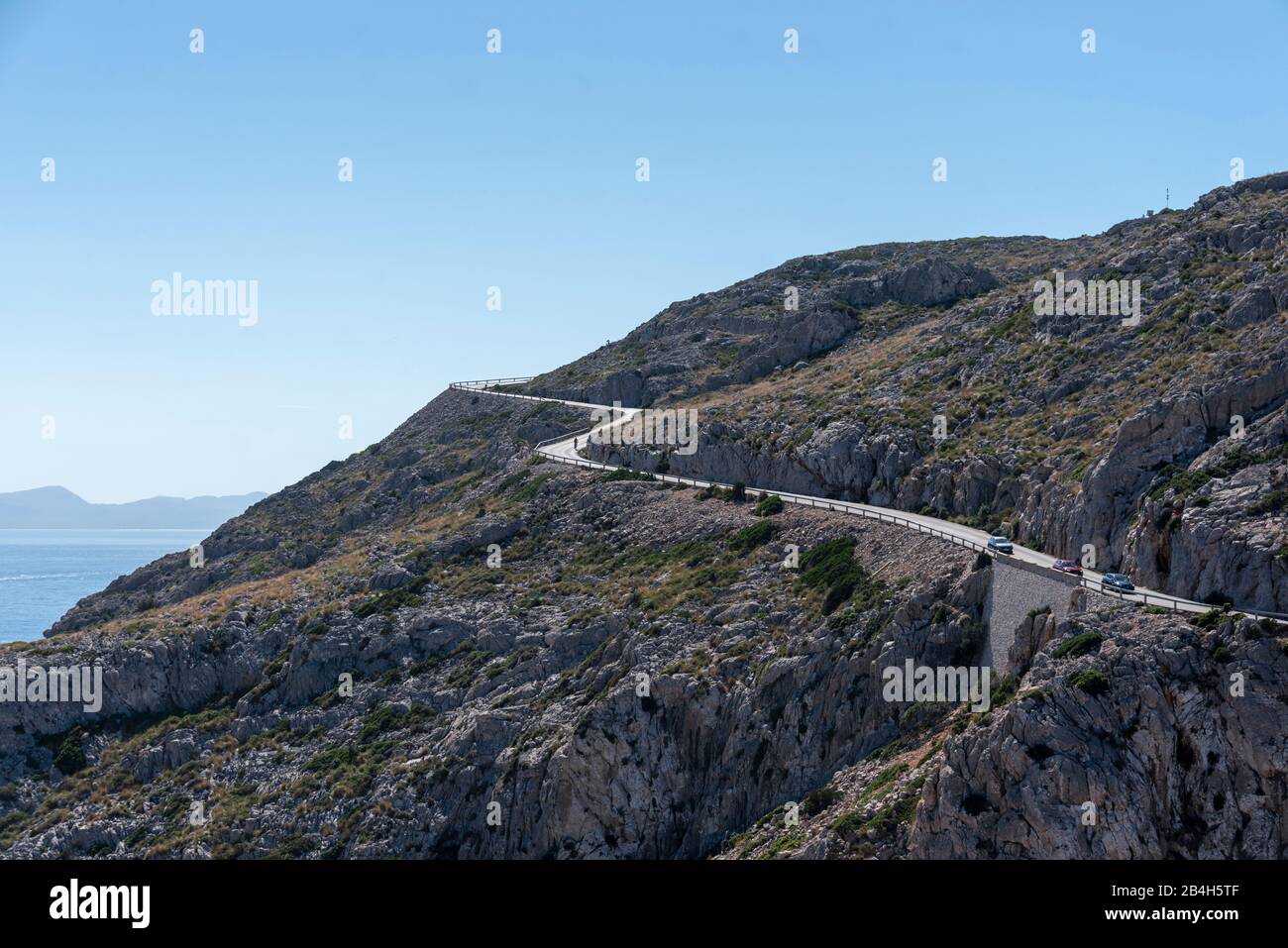 Mallorca, road to Far de Formentor, serpentines, cars at Cap de Formentor, northernmost point of the Balearic island, Stock Photo