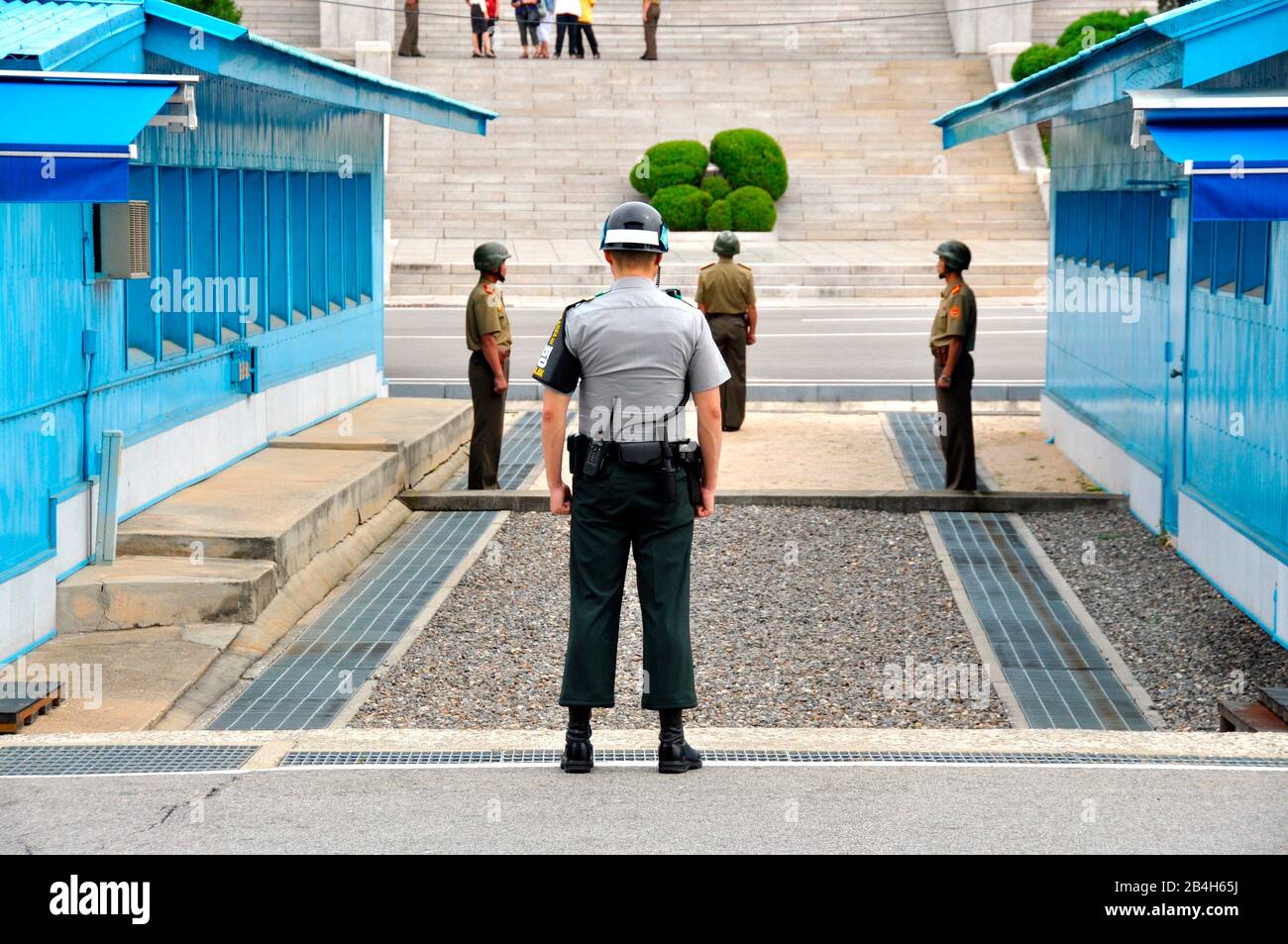 Korean soldier observes border between South and North Korea, Joint Security Zone (DMZ), Panmunjom, South Korea. Stock Photo