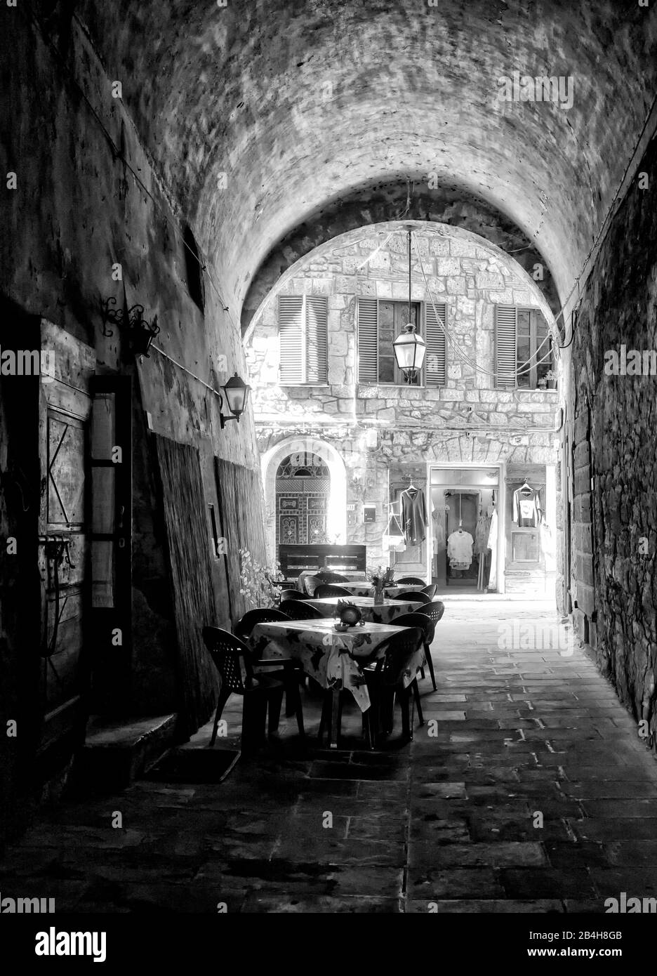 Sorano, Tuscany, Italy, restaurant, archway, old town, black and white Stock Photo