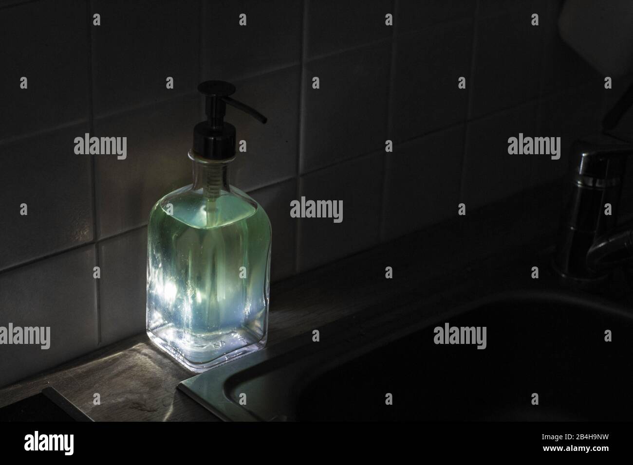 Luminous washing-up liquid Stock Photo