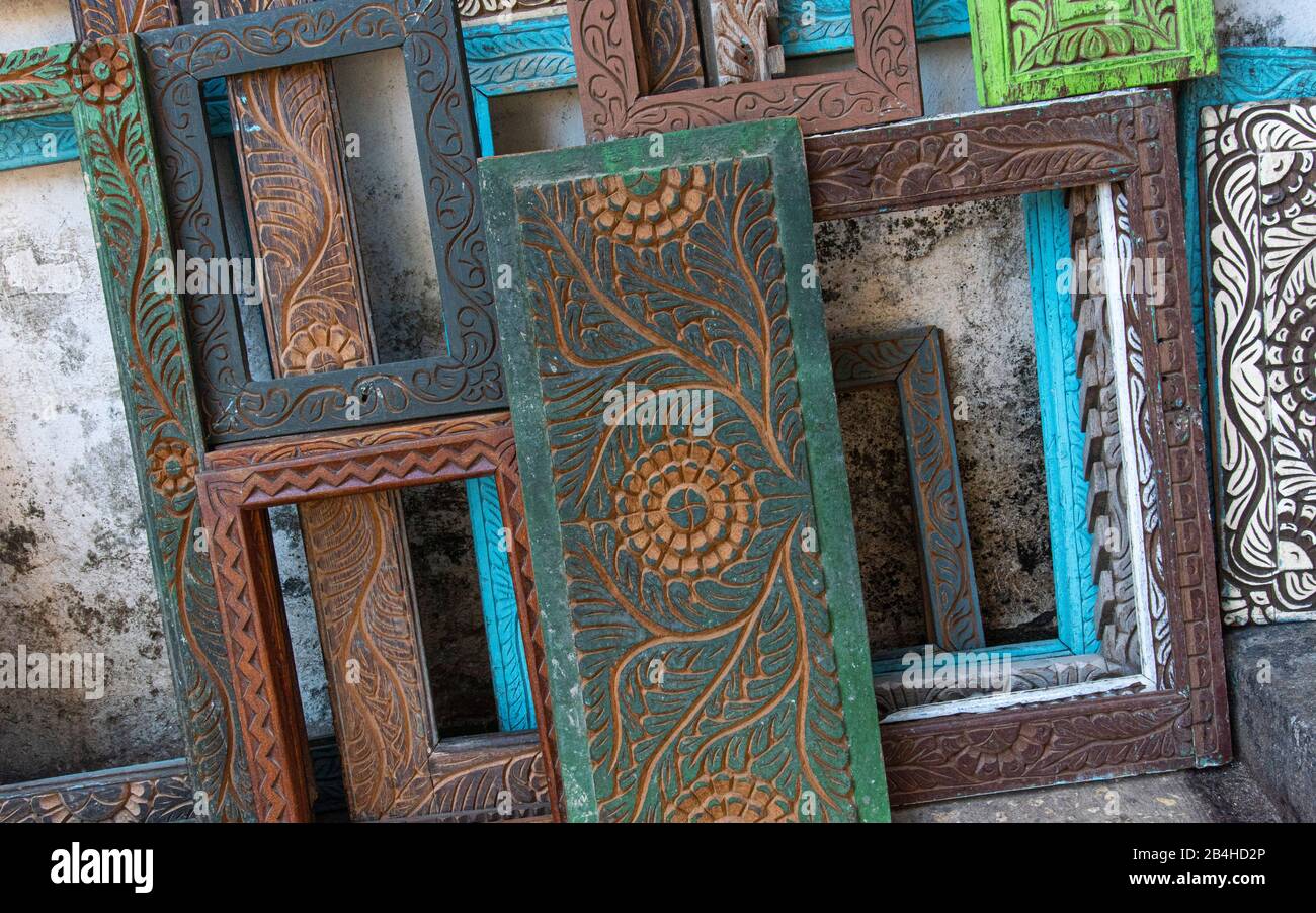 Destination Tanzania, Zanzibar Island: Impressions from Stone Town, the oldest district of Zanzibar City, the capital of the Tanzanian state of Zanzibar. Hand carved wooden shutters and picture frames in street sale. Stock Photo
