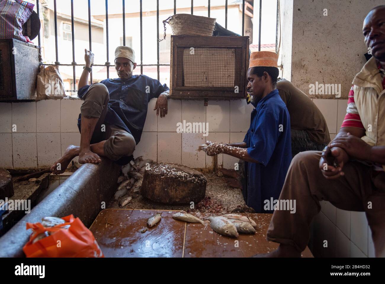 Destination Tanzania, Zanzibar Island: Impressions from Stone Town, the oldest district of Zanzibar City, the capital of the Tanzanian state of Zanzibar. Fishmonger at the fish market. Stock Photo