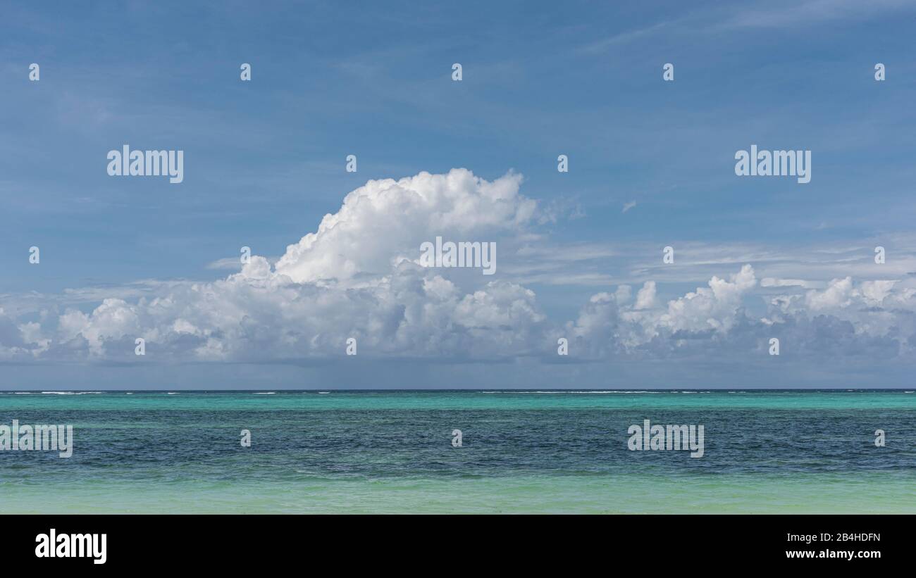 Zanzibar, Tanzania: dream beach on the east coast of this African island in the Indian Ocean. Turquoise blue sea, sky with a few harmless clouds: pure holiday mood. Stock Photo