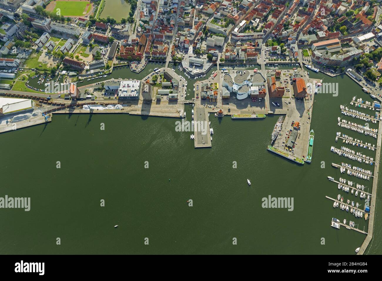 , Cityscape of Stralsund with harbor island with Ozeanum Oceanographic Museum, aerial view, 11.08.2012, Germany, Mecklenburg-Western Pomerania, Stralsund Stock Photo