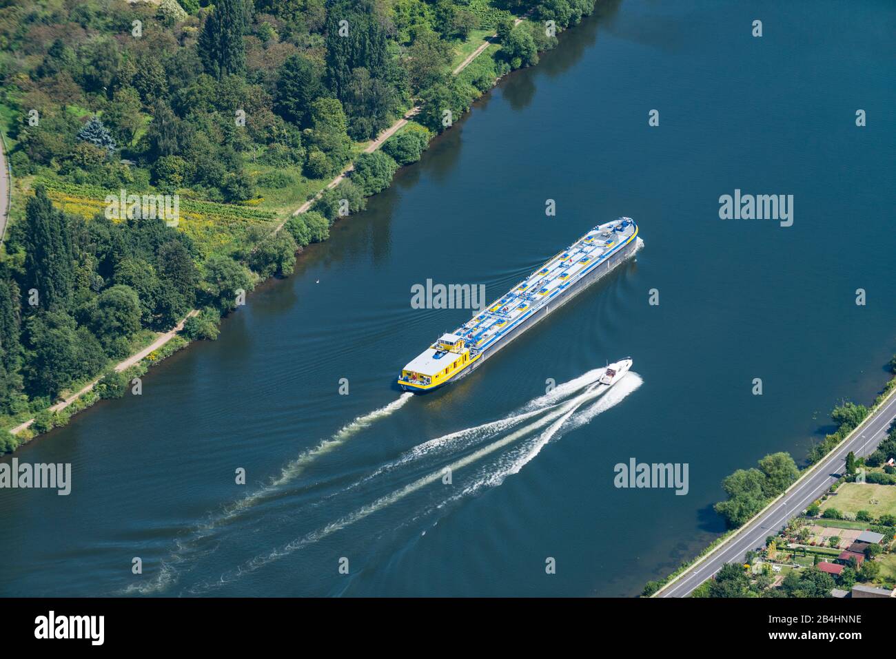 Aerial view of a cargo ship and a speedboat on the Rhine Stock Photo