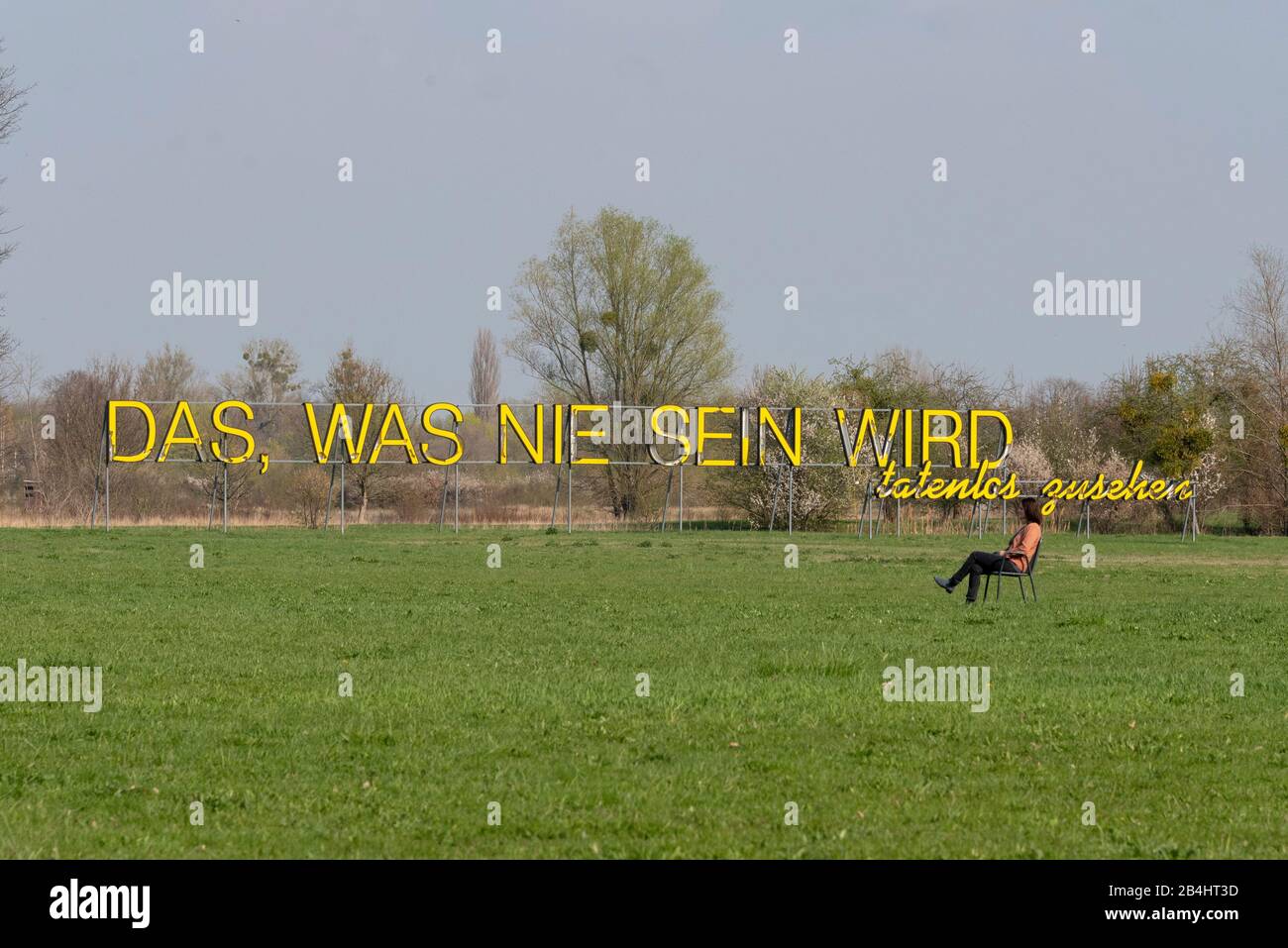 Germany, Saxony-Anhalt, Magdeburg, lettering 'That which will never be, stand by idly', Art in Elbauenpark Magdeburg, artist Ludger Gerdes 1999. Stock Photo